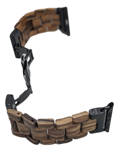 The Alpha Maui Band - Zebrawood 42mm (42-49mm) is showcased against a white background. This wooden watch band features intricately woven zebrawood links, exuding natural elegance reminiscent of Hawaii's serene beauty. The partially open black metal clasp reveals its sophisticated mechanism.