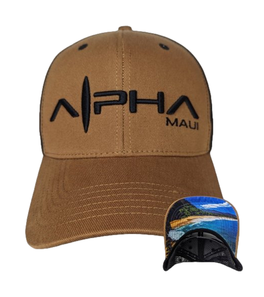 A brown baseball cap with the text "Alpha Maui" embroidered on the front in black. Below, there is an image showing the underside of the brim, which features a colorful beach scene with blue water, green trees, and a sandy shore. The Big Beach cap is a perfect addition to your beach apparel collection.