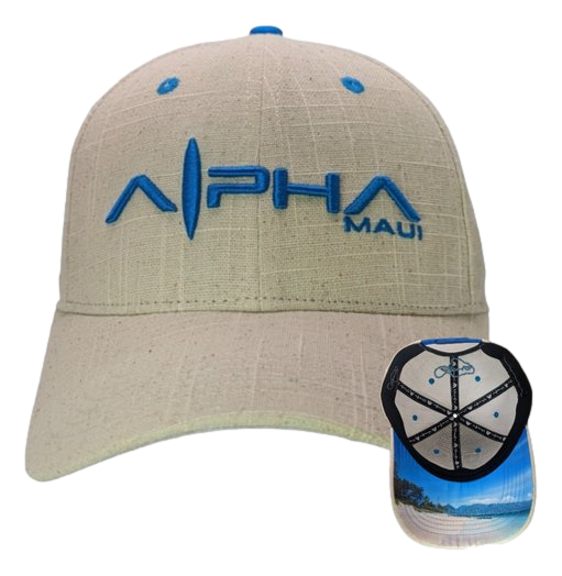 The Beachy II cap embodies the spirit of Aloha with "Alpha Maui" embroidered in blue on the front. It features a beige design with a matching blue button on top, while the underside of the brim showcases a scenic view of a tropical beach with ocean waves and palm trees.