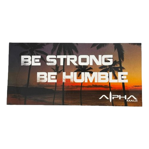 Text reads "Let The Universe...Do It's Thing" in bold white letters over a silhouette of palm trees against a backdrop of a sunset or sunrise. The logo "Alpha Maui" is in the bottom right corner, capturing the essence of beach apparel and the spirit of Aloha.