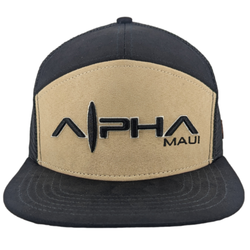 The Alpha Maui Mauka baseball cap features a black and tan color scheme with "Alpha Maui" elegantly embroidered on the front panel in black, showcasing a stylish design. Perfect for beachwear, this hat has a flat brim and mesh backing, making it an ideal accessory for your next trip to Hawaii.